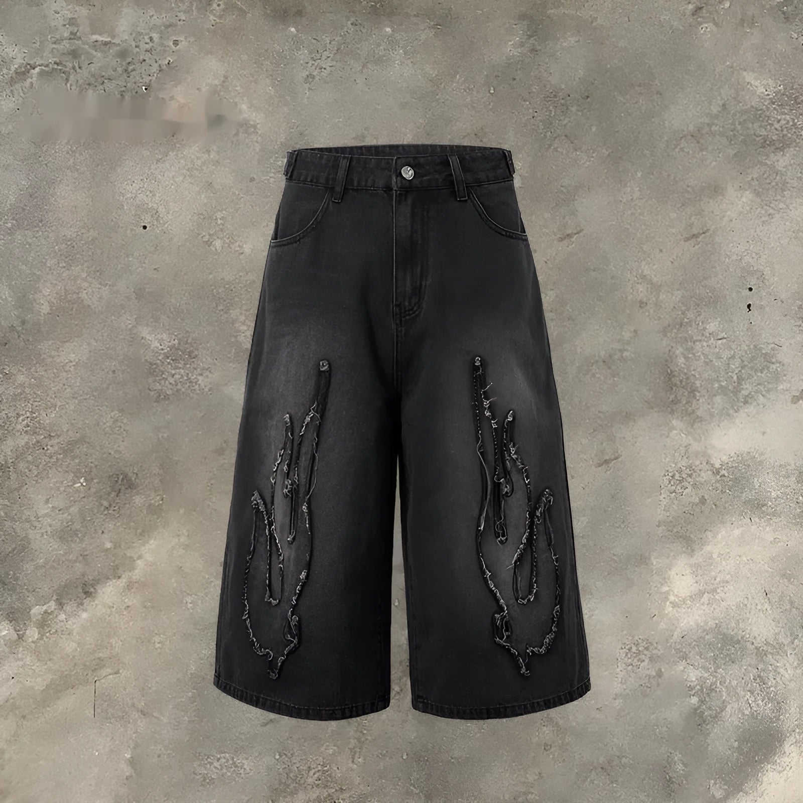 Men's black denim shorts with flame embroidery patch on leg, cropped straight cut style