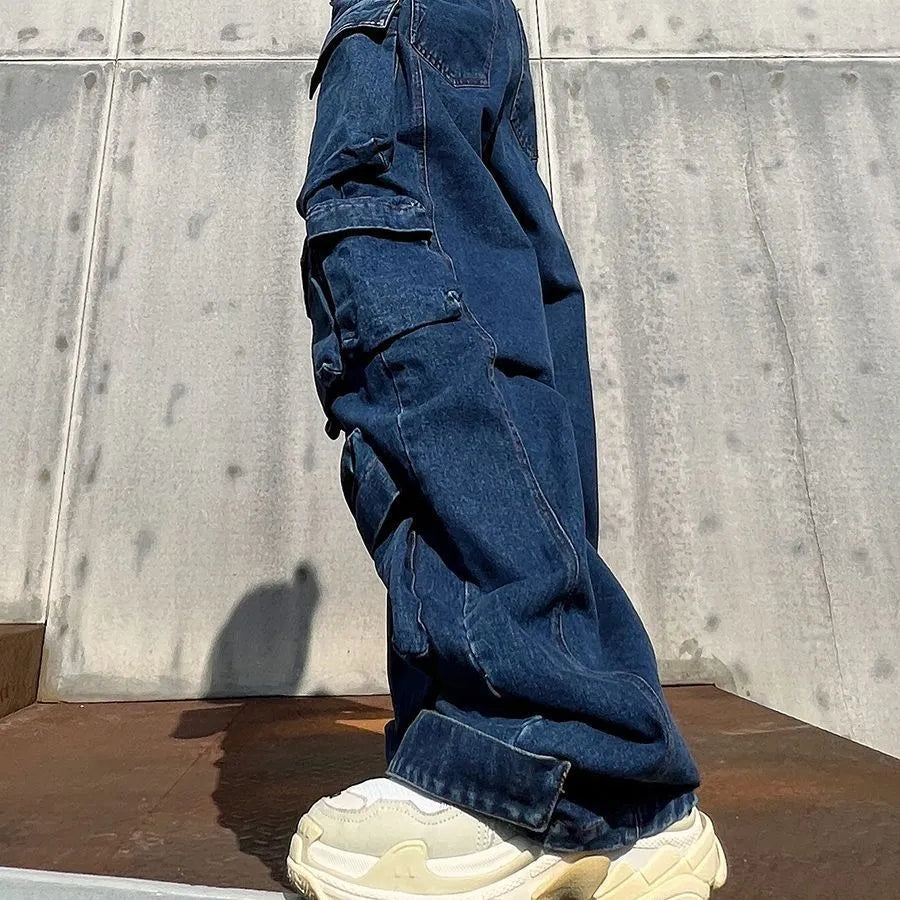 Dark blue women's distressed wide-leg jeans with a high waist and multiple utility pockets.