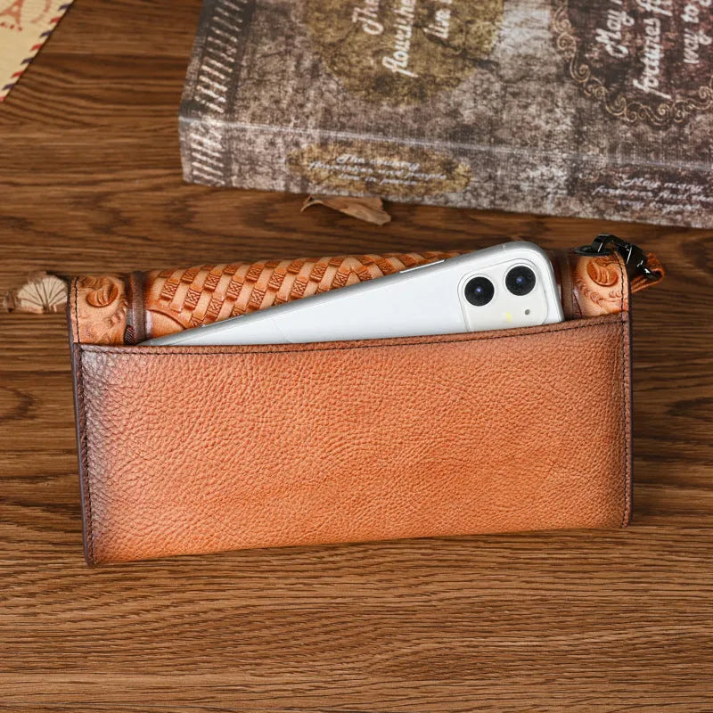 Retro brown embossed floral pattern tri-fold women's wallet made of genuine cowhide leather.