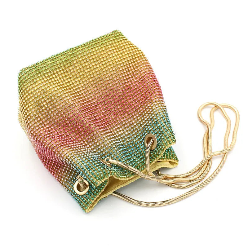 Rhinestone bucket bag with sparkling coverage and adjustable shoulder straps