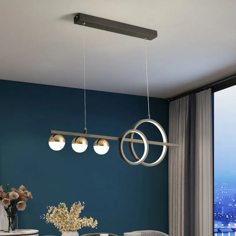 Modern rectangular aluminium ceiling light in black finish with remote control on a white ceiling.