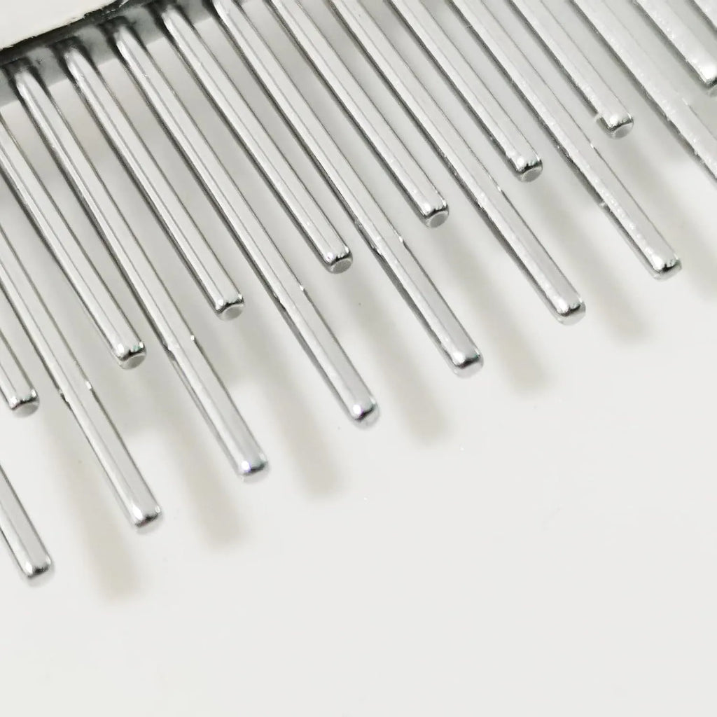 Red plastic handle pet comb with dual-length stainless steel teeth for detangling and dematting.