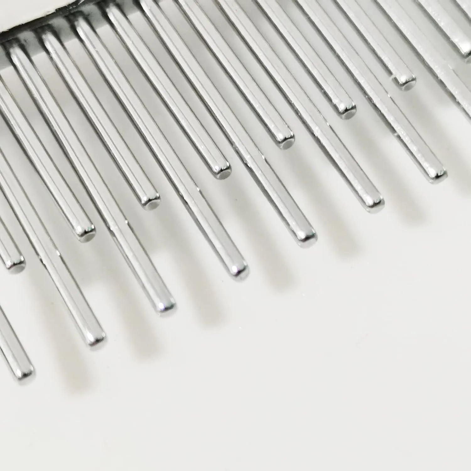 Red plastic handle pet comb with dual-length stainless steel teeth for detangling and dematting.