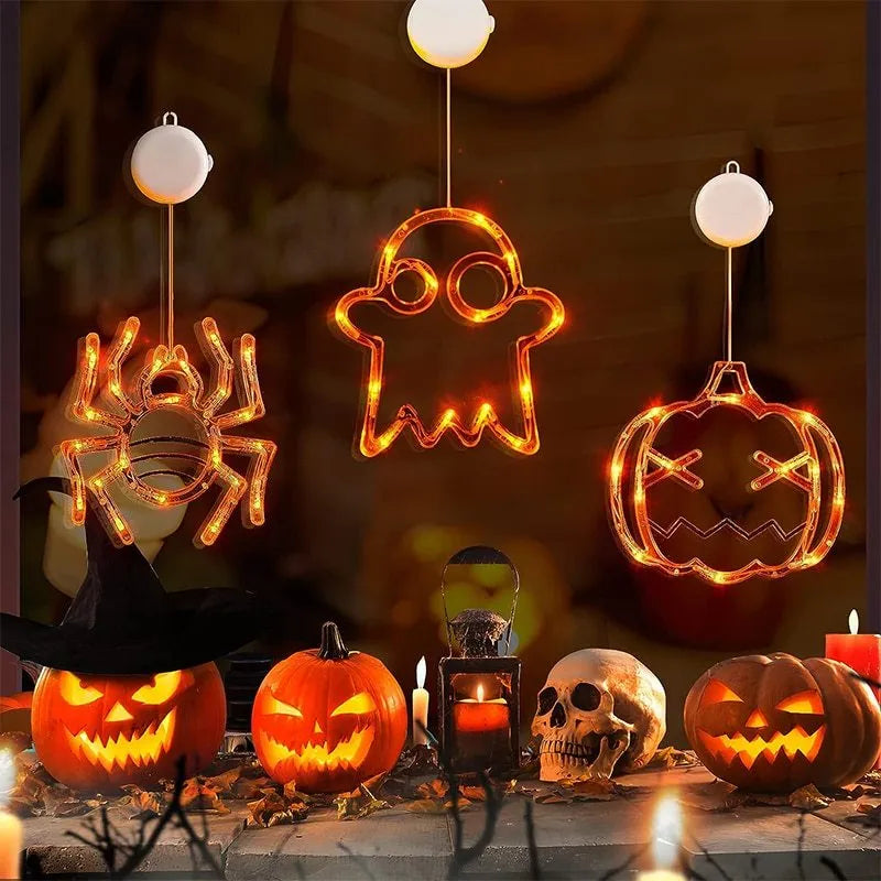 Seven Halloween-themed LED hanging lights with suction cups including spiders, pumpkins and ghosts