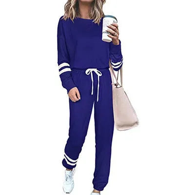 Women's loose-fitting casual suit set in a solid colour, comprising a long-sleeve top and matching trousers.
