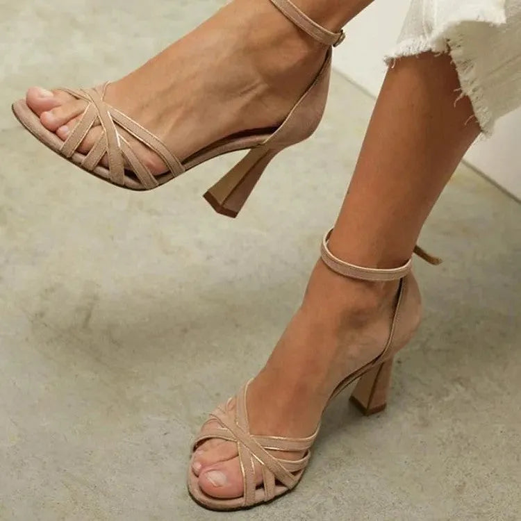Apricot coloured suede women's high heel sandals with peep toe and bag heel design on a rubber sole.