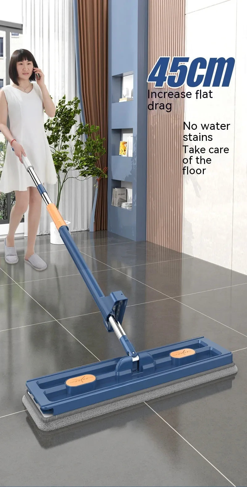 Large flat mop with stainless steel handle and blue rotating mop head on hard floor