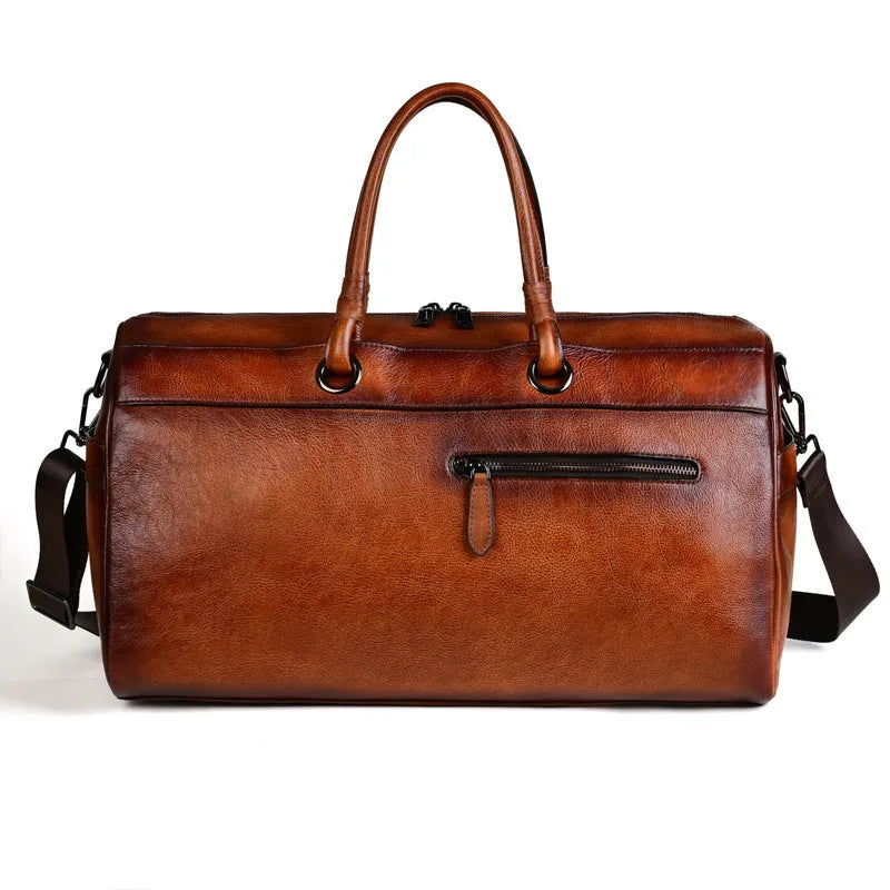 Handmade retro style leather travel bag in vintage brown colour showing expansion functionality