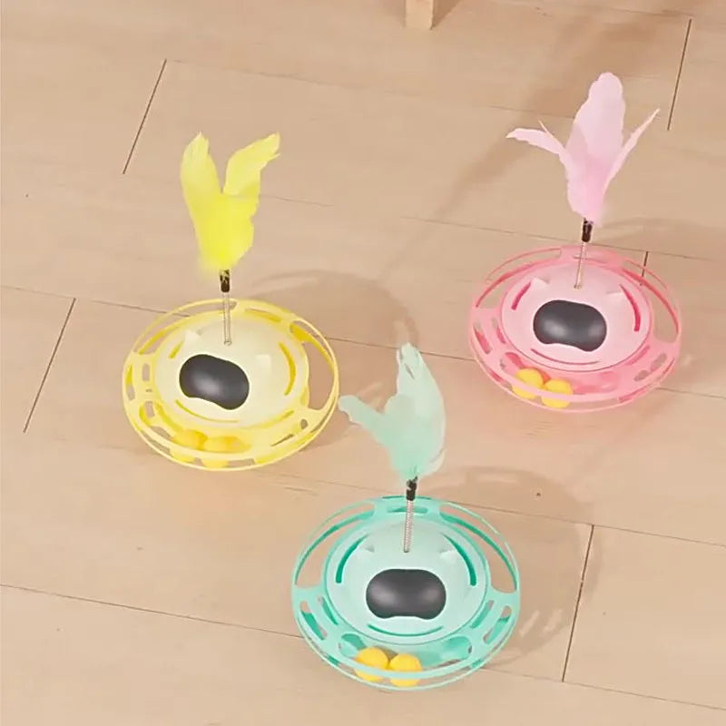 Pink stick-shaped cat toy turntable tumbler with self-hi feature on flat surface