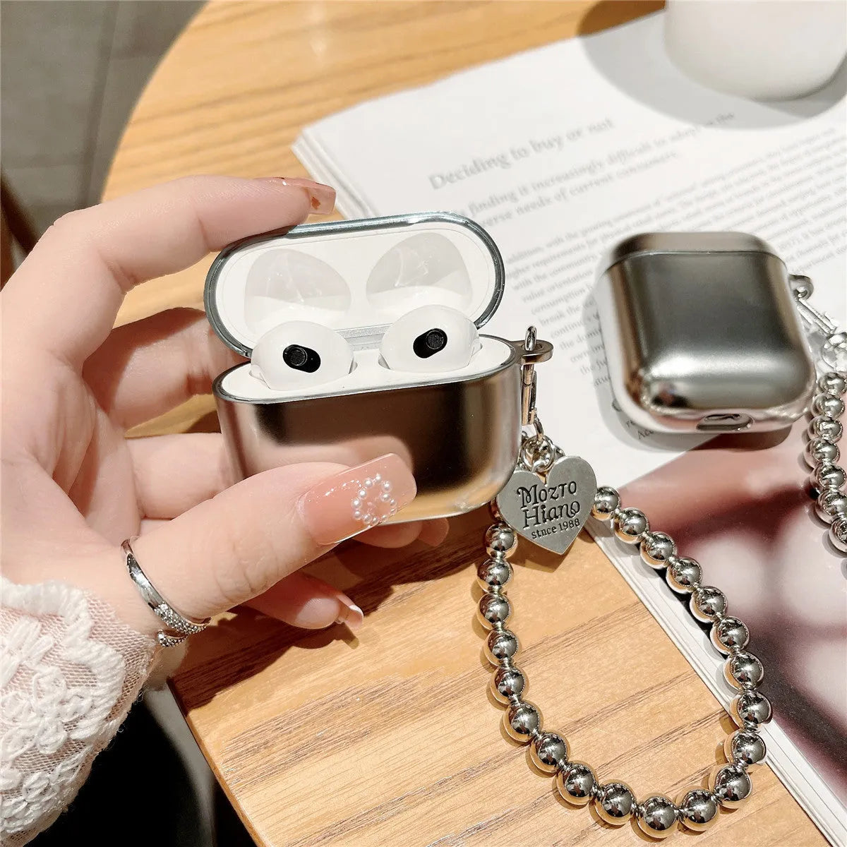 Matte plating TPU protective case for Apple AirPods shown on a table.