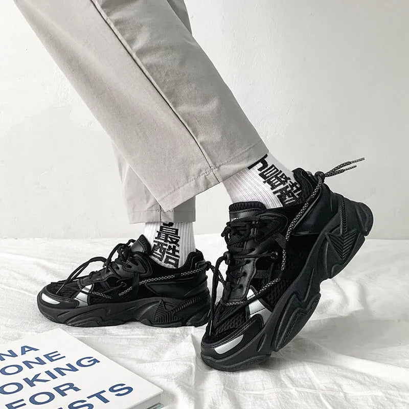 Men's platform dad shoes in black, white, or grey with a lace-up front and a thick sole.