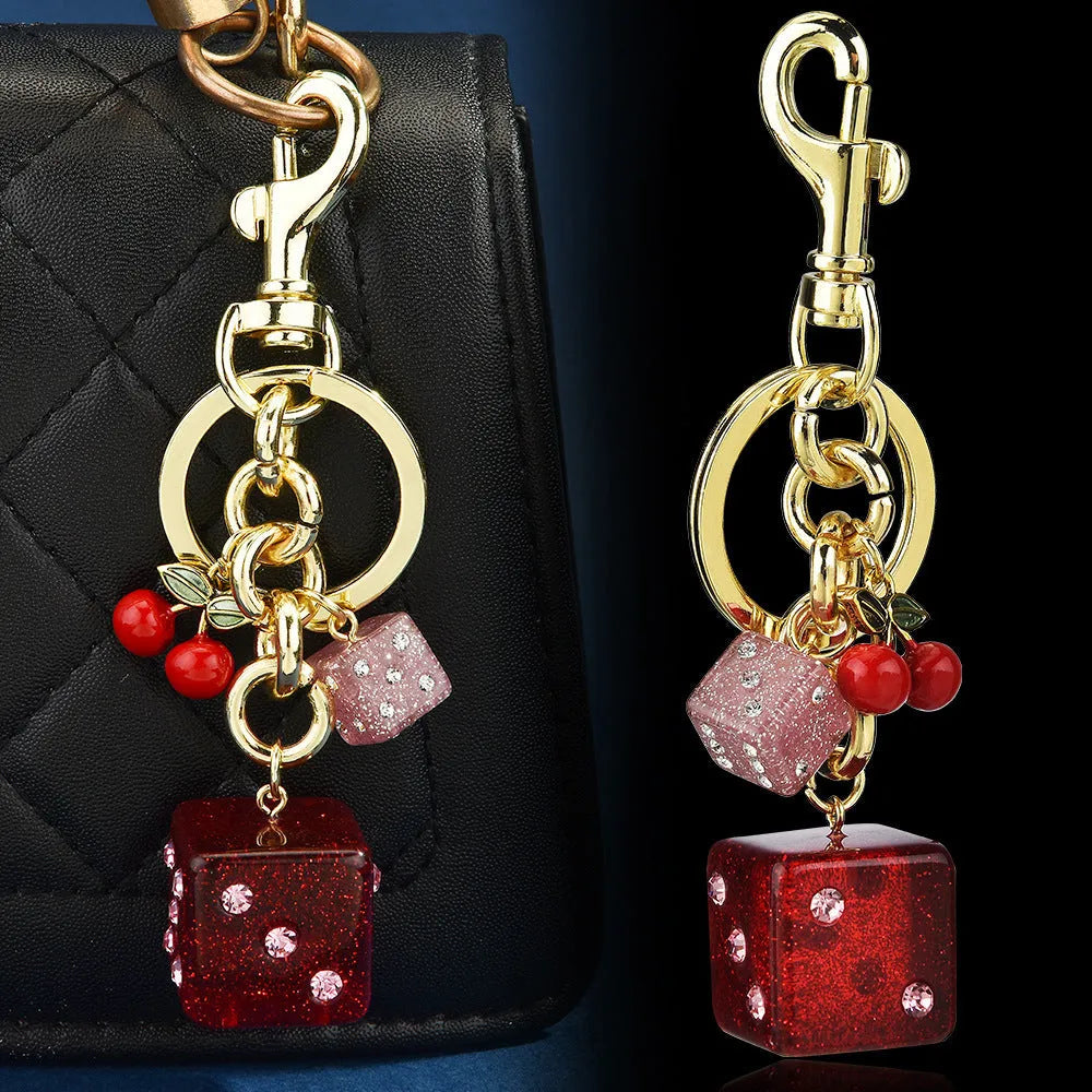 Square metal dice keychain pendant with cherry electroplated finish and keychain attachment