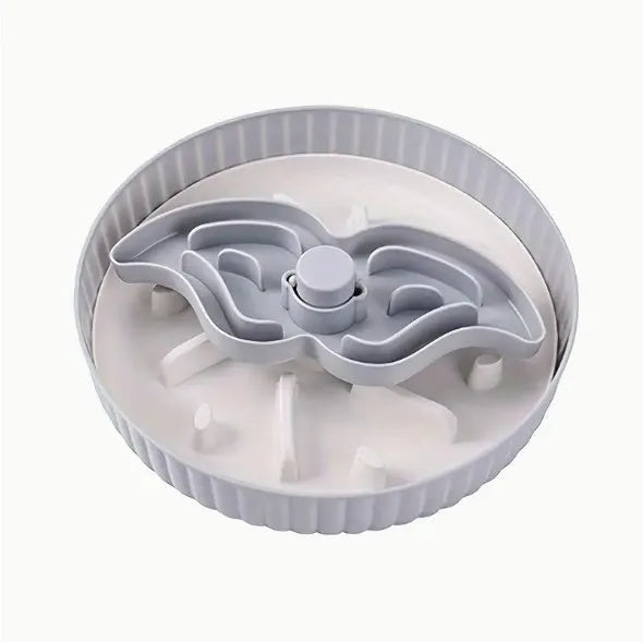 Grey plastic pet bowl with rotating windmill-pattern slow feeder licking mat inside