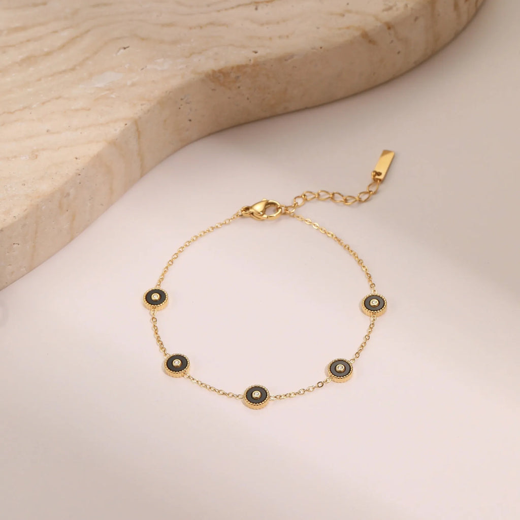 Geometric fritillary design stainless steel bracelet with 18K gold plating and matching necklace