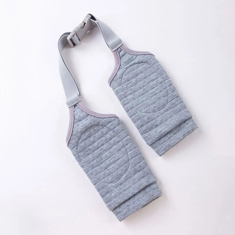Blue dog knee protector with adjustable straps and matching scarf on medium-sized dog