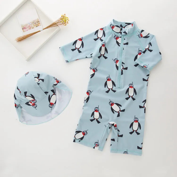 Boys' penguin print long sleeve one-piece swimsuit with matching swimming cap set.