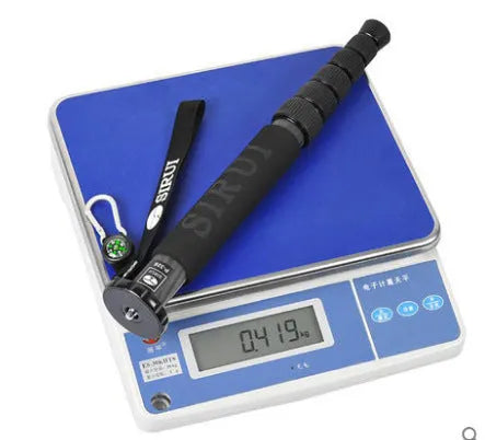 Black carbon fibre monopod for DSLR cameras extended to show six-section design