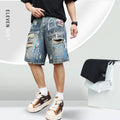 Blue men's ripped denim shorts with graffiti-style detailing and straight-leg cut.