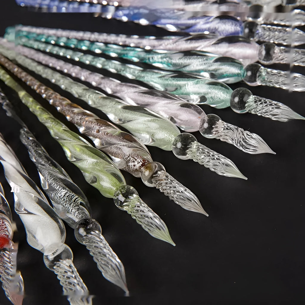 Transparent glass art pen with coloured ink dipped design in a gift box.