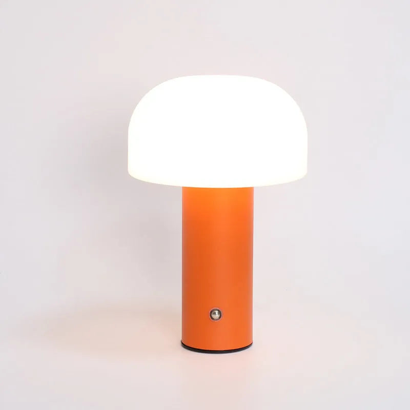 USB dual-purpose table lamp in black, green, orange or white with plug-in and charging functionality