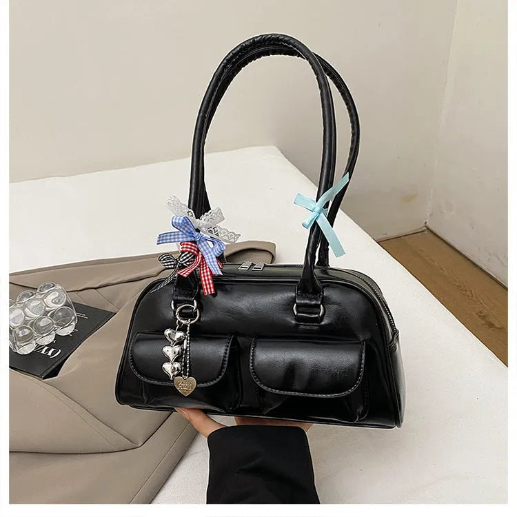Retro brown pillow-shaped women's shoulder handbag with a flap closure and double strap