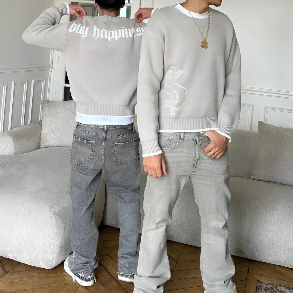 Grey loose-fitting knitwear coat with long sleeves and textured Jacquard weave pattern