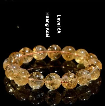 Natural yellow citrine gemstone bracelet showing single circle and three circle bead designs on a wrist.