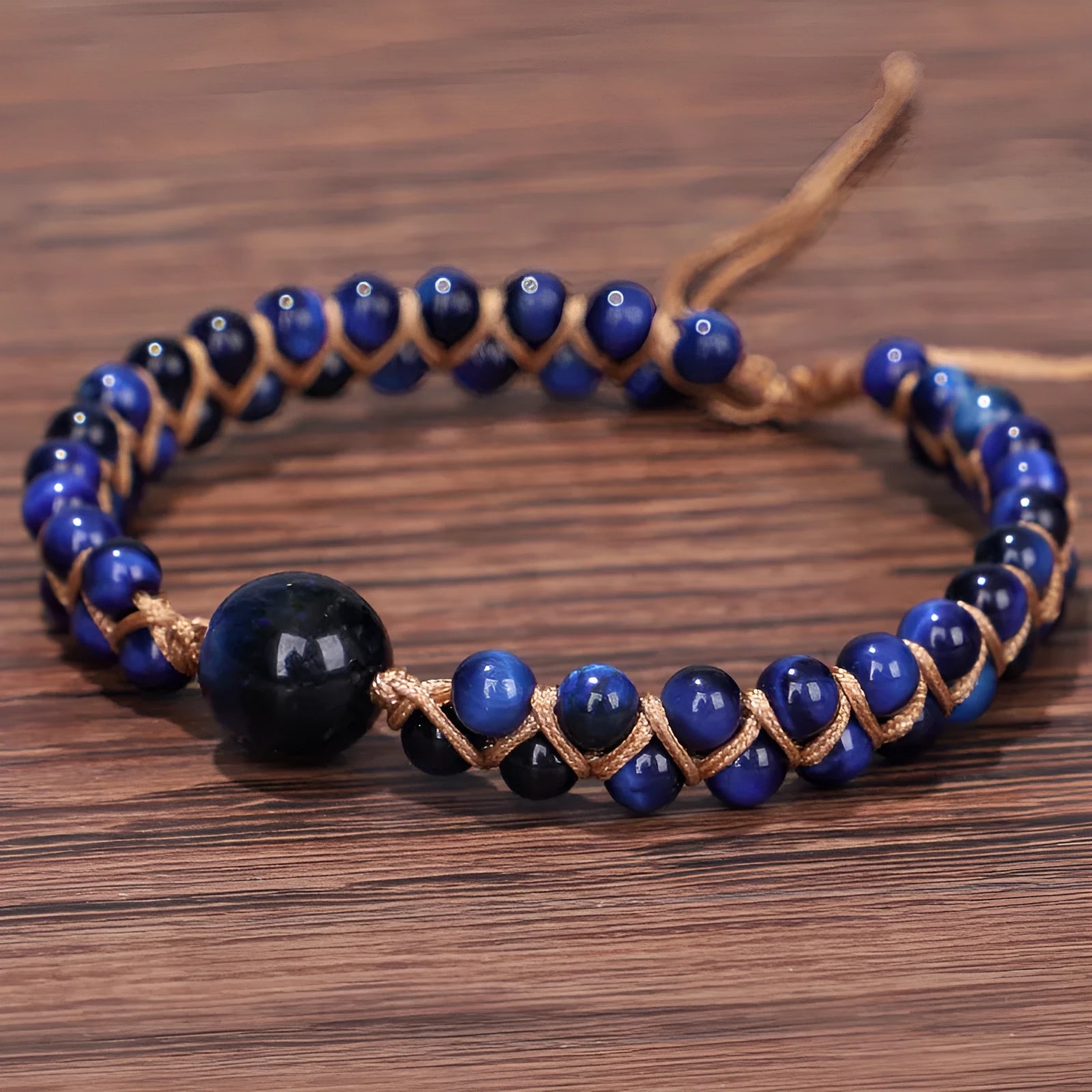 Handmade woven pull bracelet with tigereye and amethyst beads in geometric pattern