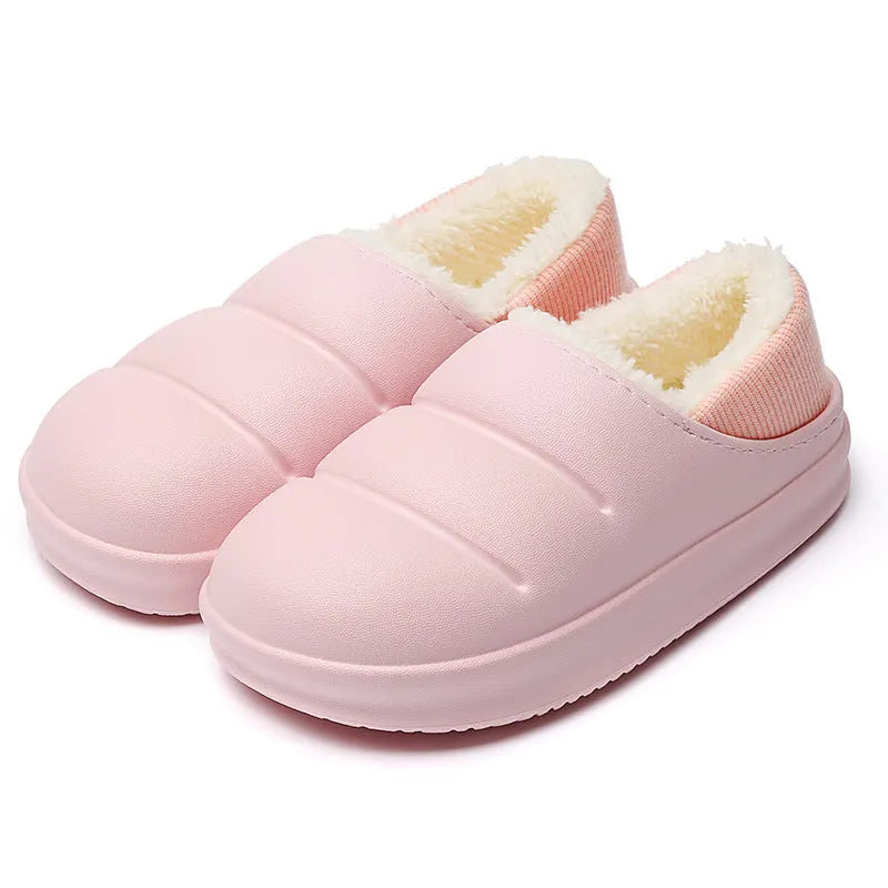 Green EVA waterproof garden slippers with non-slip sole and plush lining shown on wooden decking