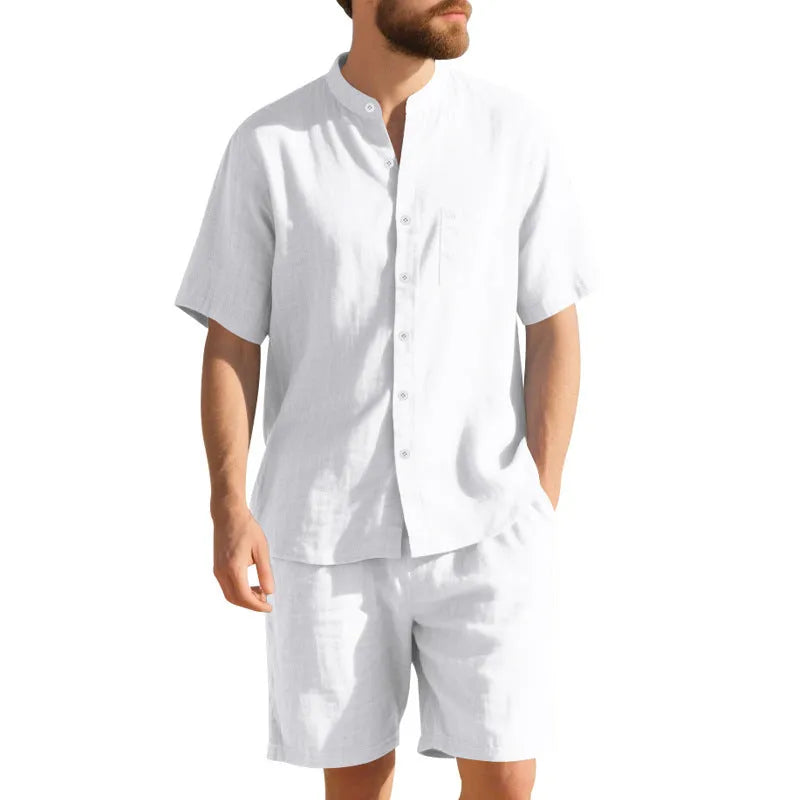 Men's light blue linen-blend summer suit with short sleeve shirt jacket and matching shorts on a hanger.