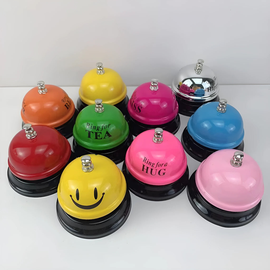 Iron game bell in one of ten colours: red, green, blue, pink, yellow, or other variants.