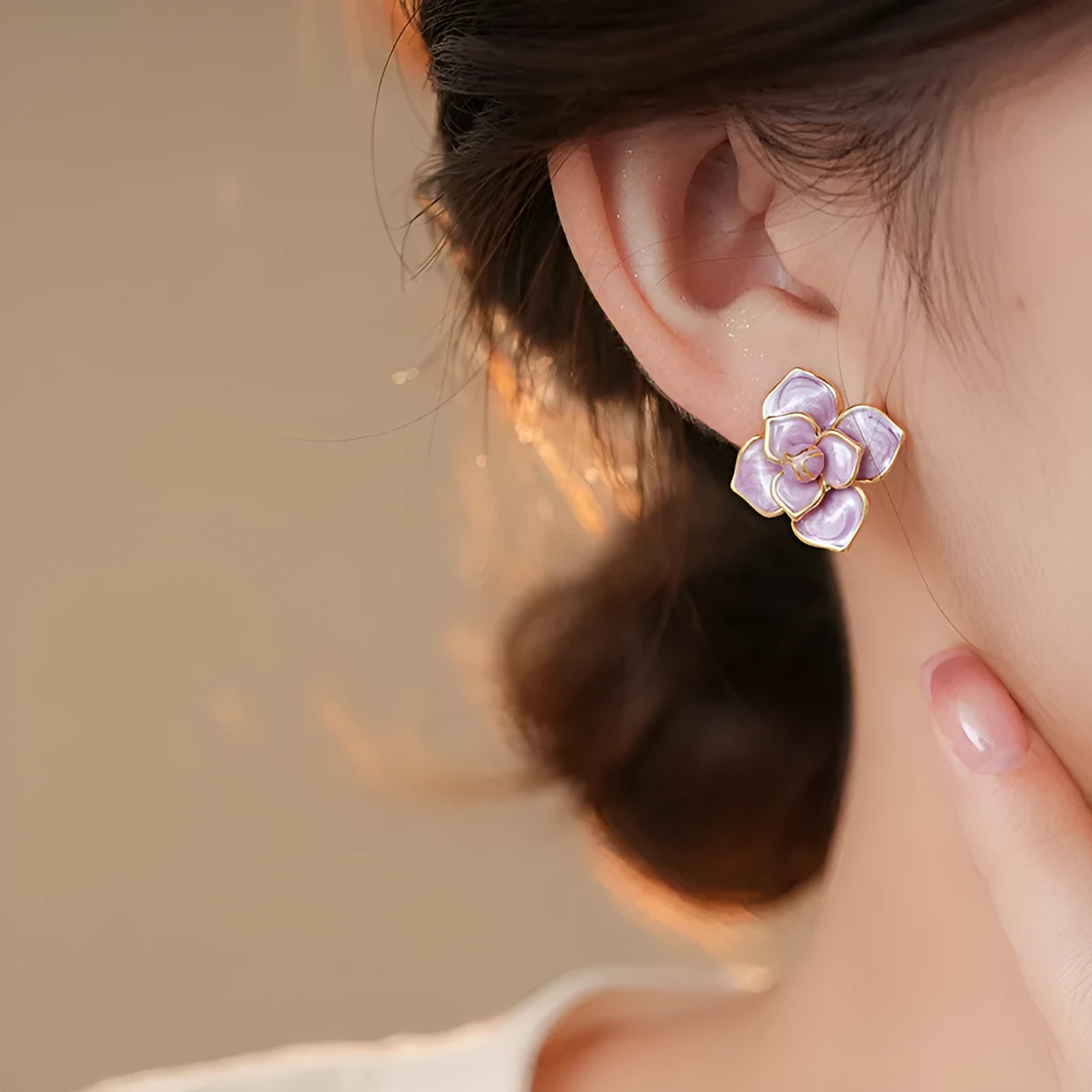 Gold plated purple flower stud earrings with an oil-spot glaze effect on copper
