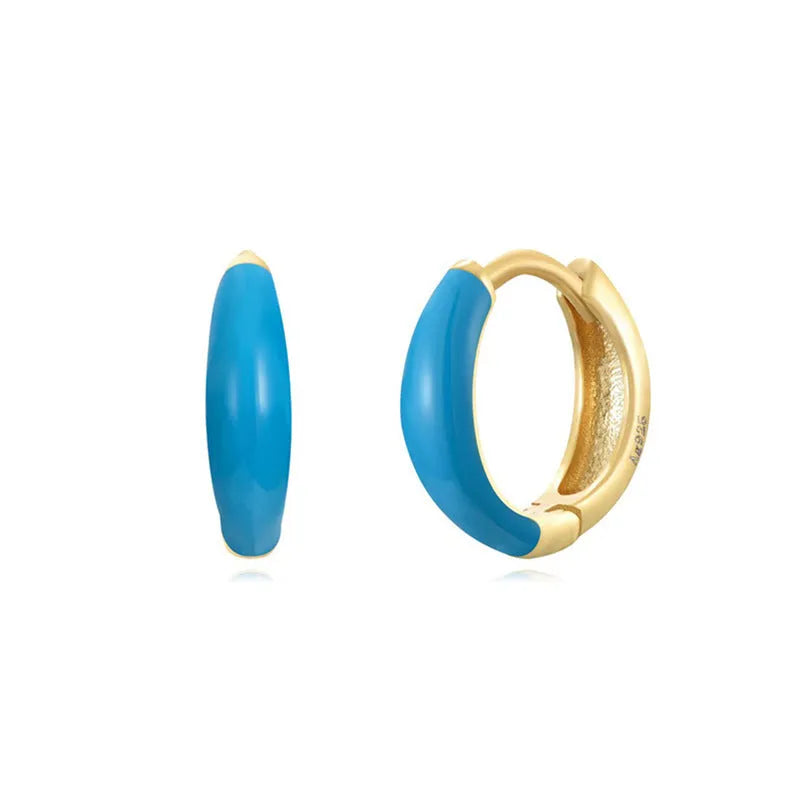 Geometric U-shaped epoxy earrings with a dripping oil finish in various colours.
