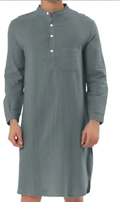 Man wearing a dark blue cotton robe shirt with button front and chest pocket