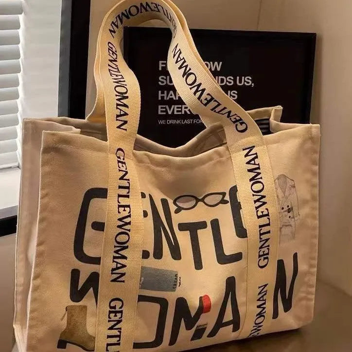 Large canvas women's tote bag with printed design, shown in available colour and pattern options