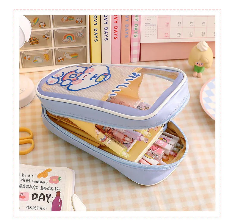 Large transparent PVC pencil case with cartoon bear, rabbit, and dog designs for student stationery.