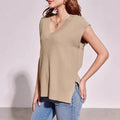 Camel and white loose v-neck sleeveless pullover vests in striped and plaid viscose fabric