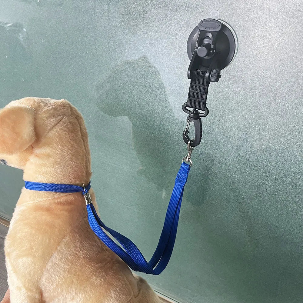 Pet bathing restraint suction cup handcuffs in black and blue with small and large suction cup sizes