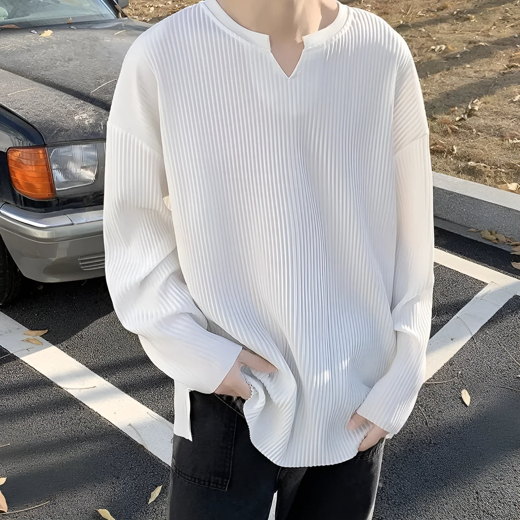 Plus size women's loose pullover top with long sleeves in striped or solid colours