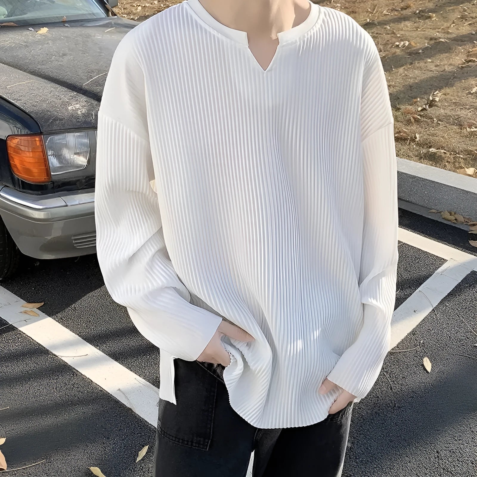 Plus size women's loose pullover top with long sleeves in striped or solid colours