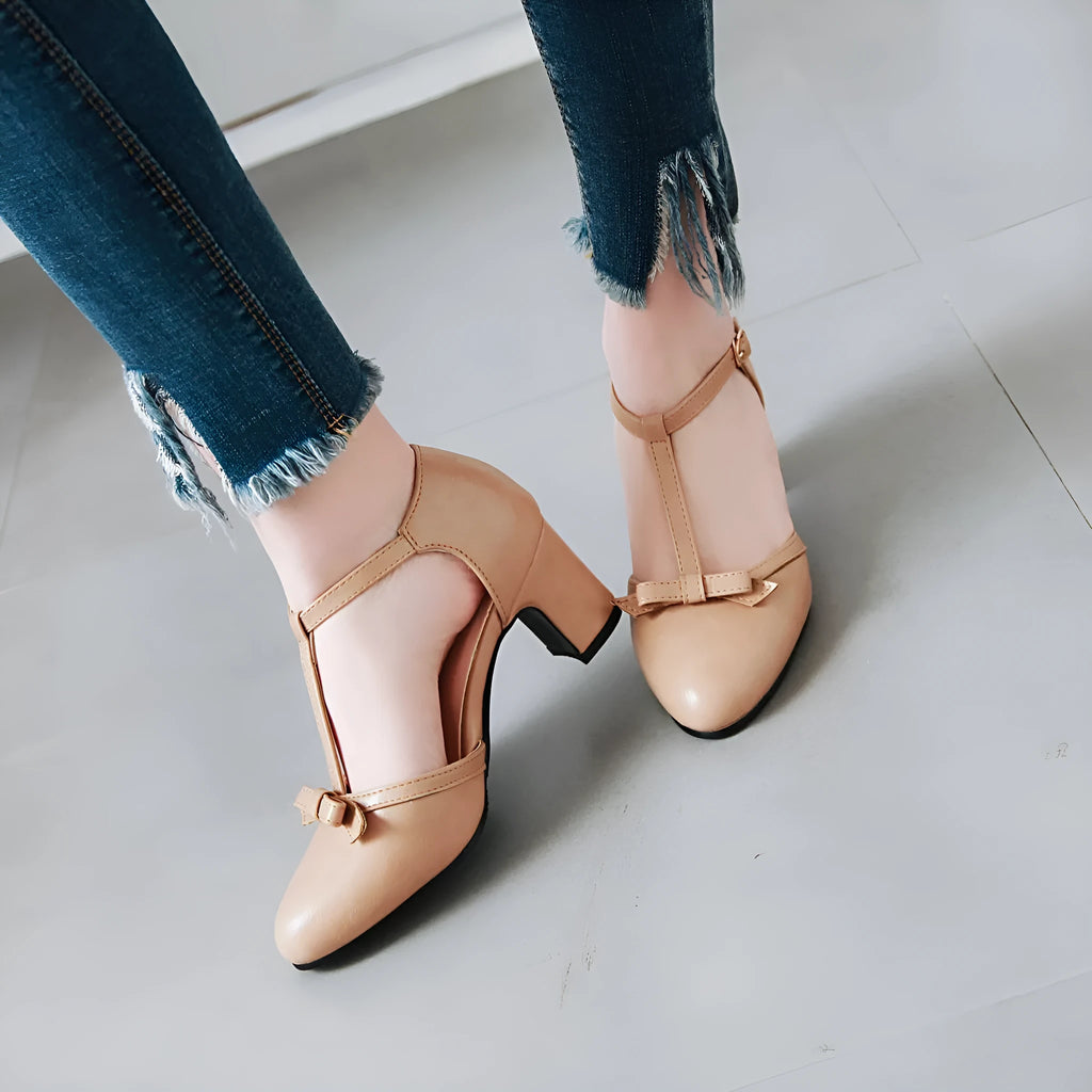 Women's solid colour sandals with chunky 6.5cm heel, buckle strap, and bow detail