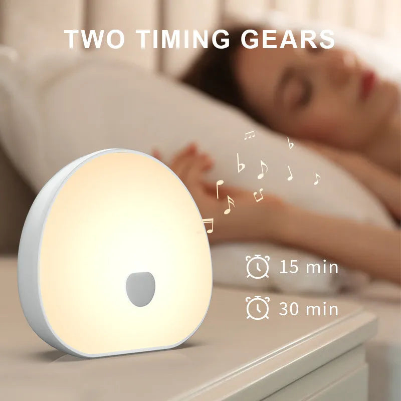 White rechargeable baby night feeding comforter sleeper unit with music function.
