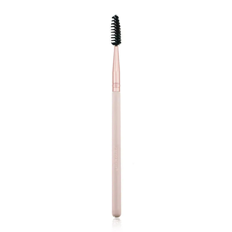26 pink makeup brushes with wood handles arranged in a PU travel pouch.