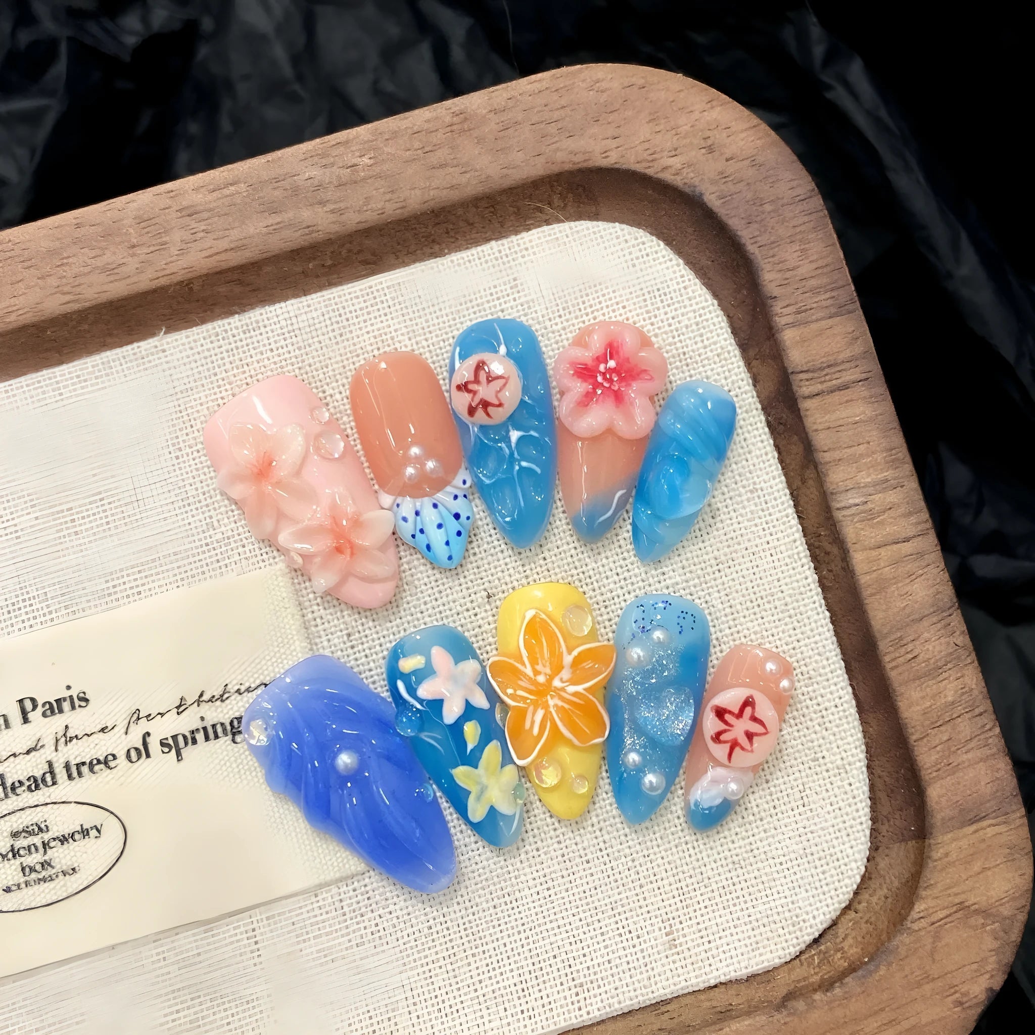 Plastic marine style armour with three-dimensional carved jellyfish design in almond nail colour