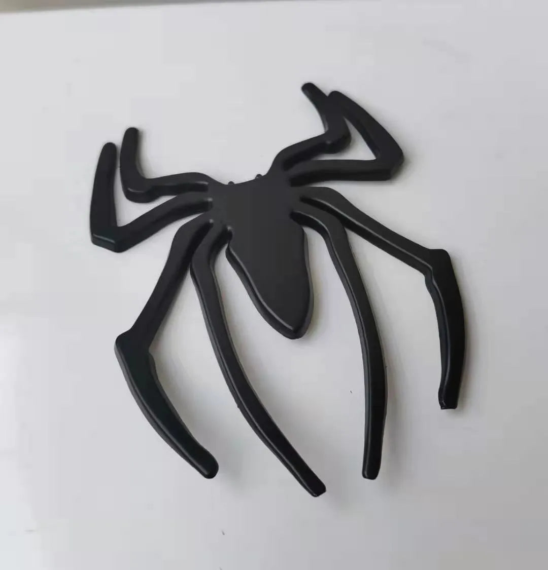Three-dimensional metal spider bumper sticker in zinc alloy, showing detailed design