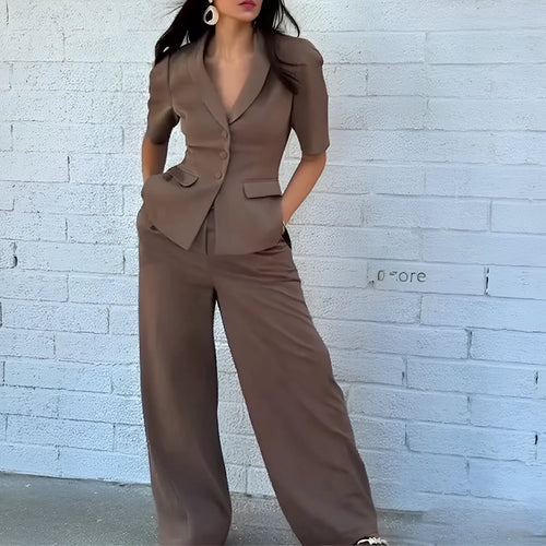 Brown men's two-piece polyester suit set with slim-fit waist, showing long-sleeved top and full-length trousers.