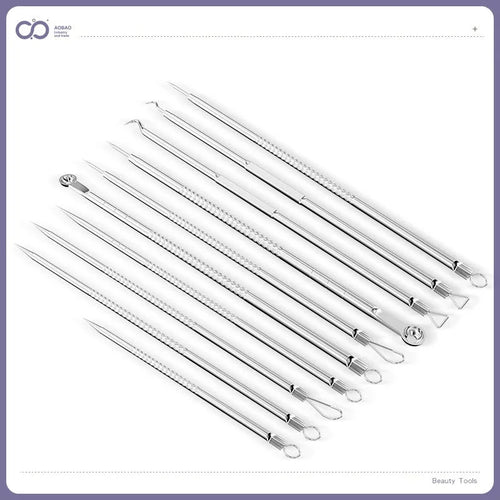 Four silver metal acne needles with pointed tips for skincare extraction