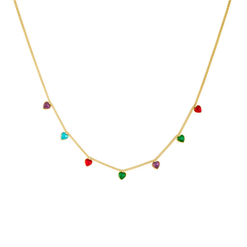 Gold-plated stainless steel heart necklace on a model, showing adjustable length.