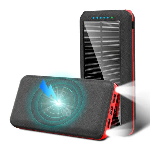 Black portable power bank with solar panel, wireless charging surface, and three USB output ports