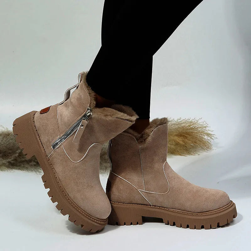 Women's black high-top snow boots with side zipper and thick plush lining on a winter background.